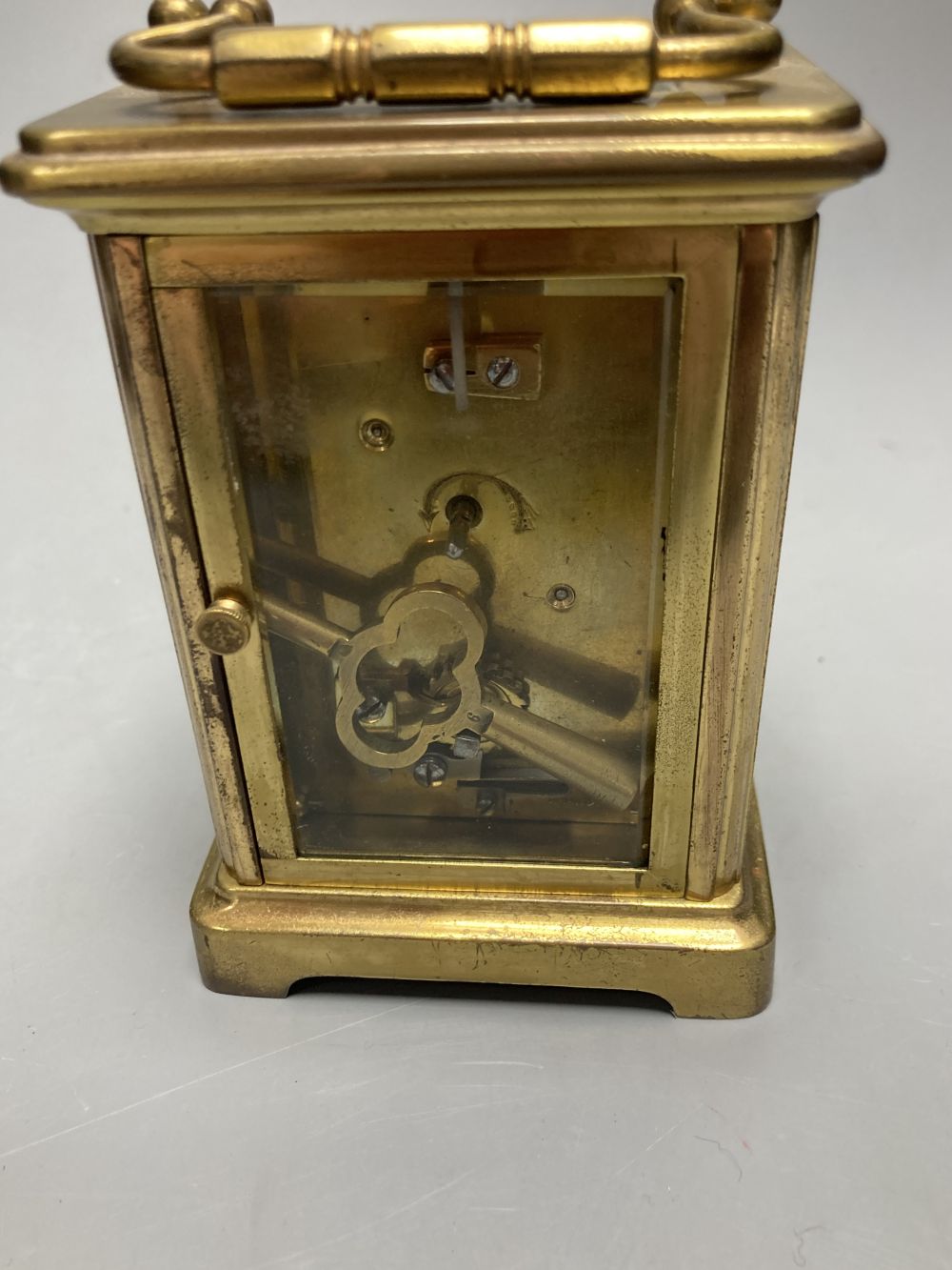 A gilt-brass carriage timepiece, with white enamelled Roman dial and outer travelling case and another carriage clock (2)